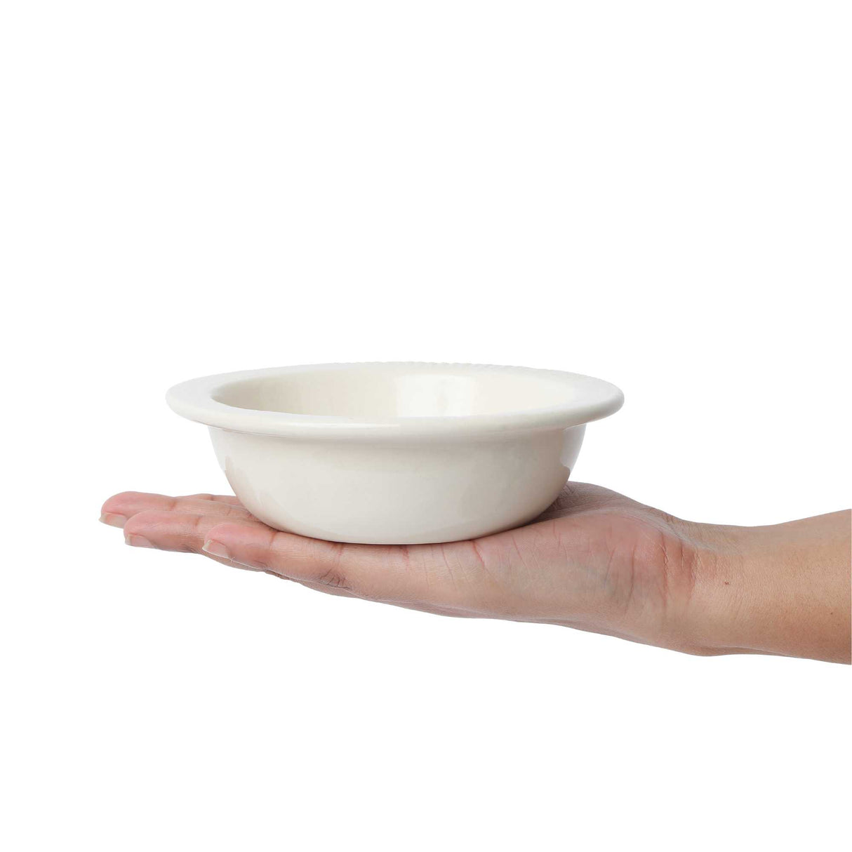 White ceramic bowl in hand