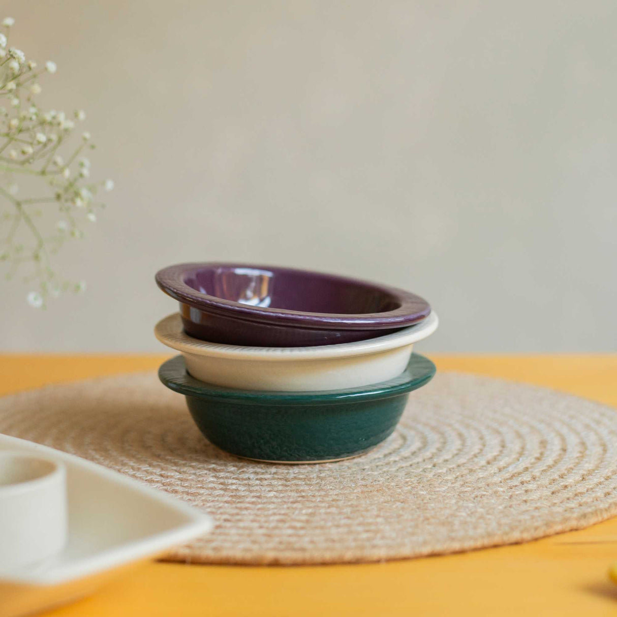 3 different coloured ceramic bowls
