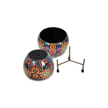 Colourful pot with black plant stand