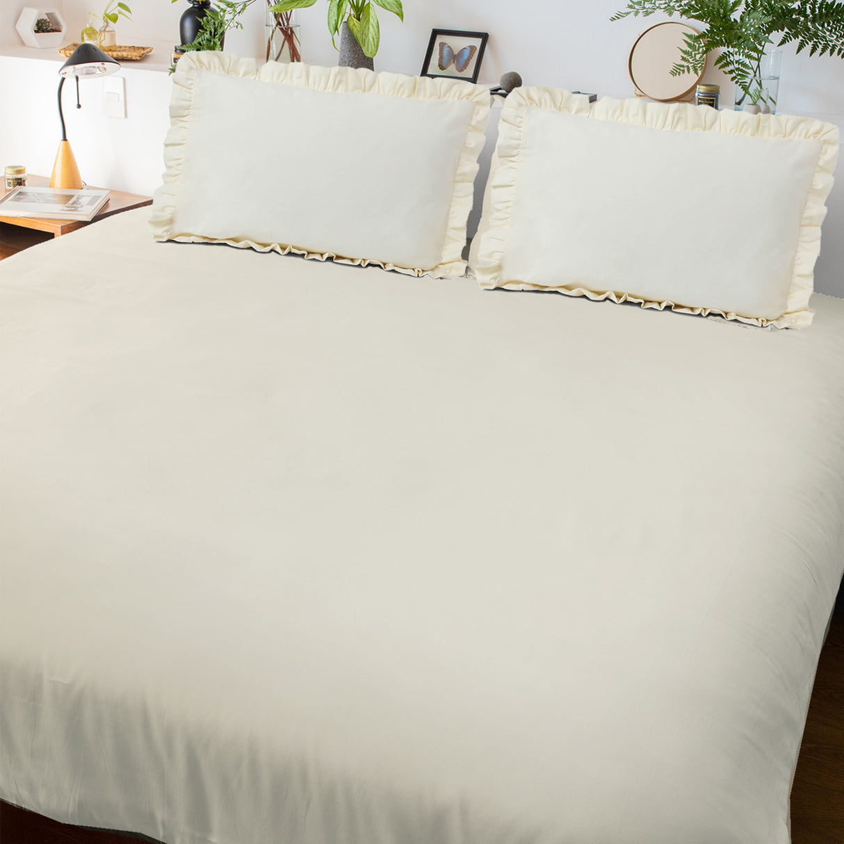 Plain white bedsheet with pillow covers