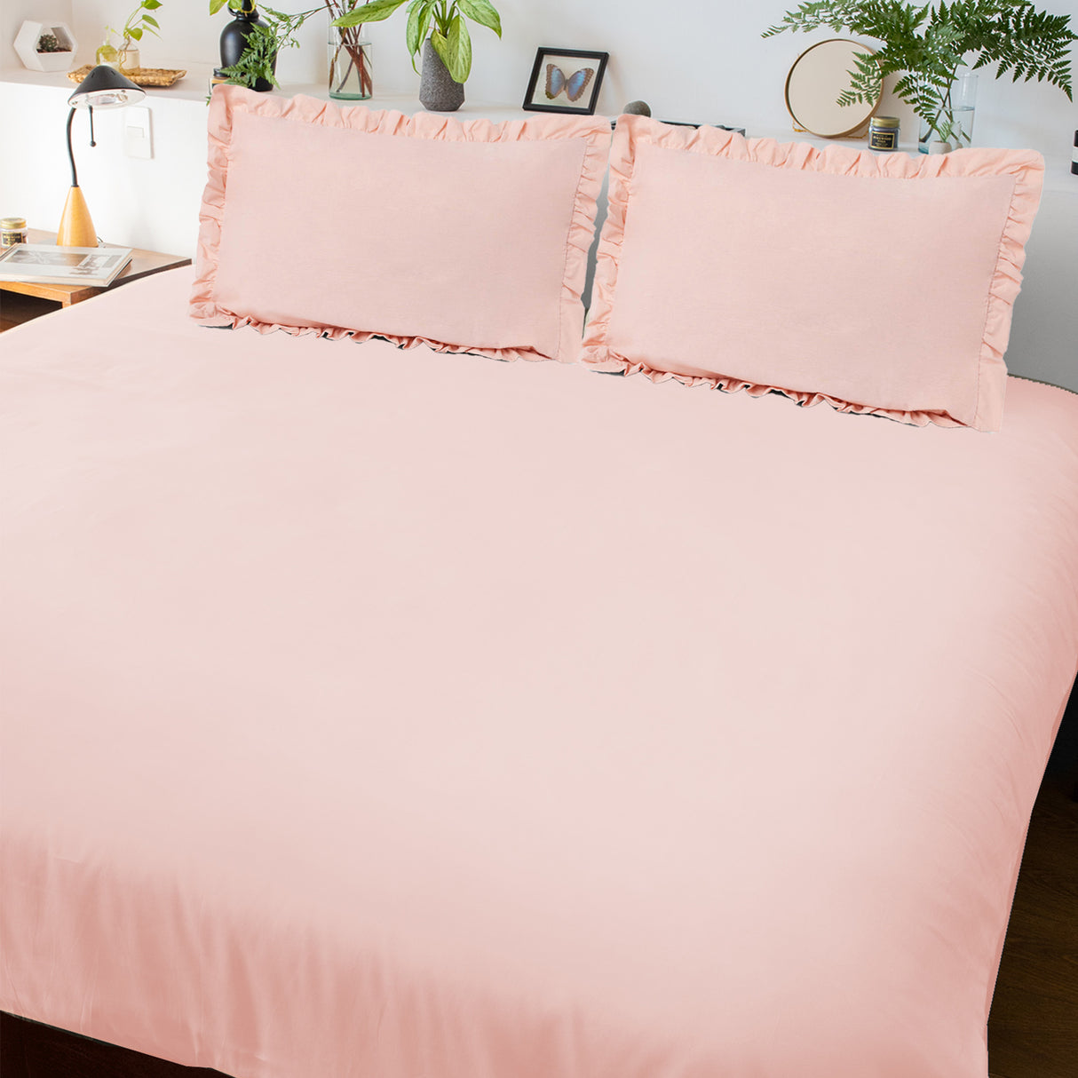 Light pink bedsheet with pillow covers