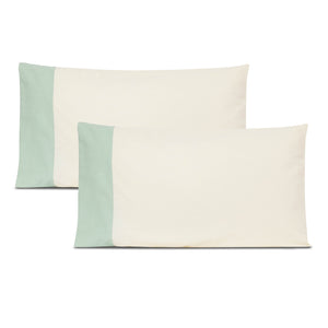 White pillow cover with green border