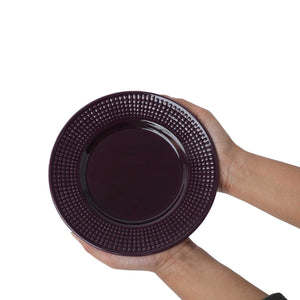 Deep purple ceramic plate in hand