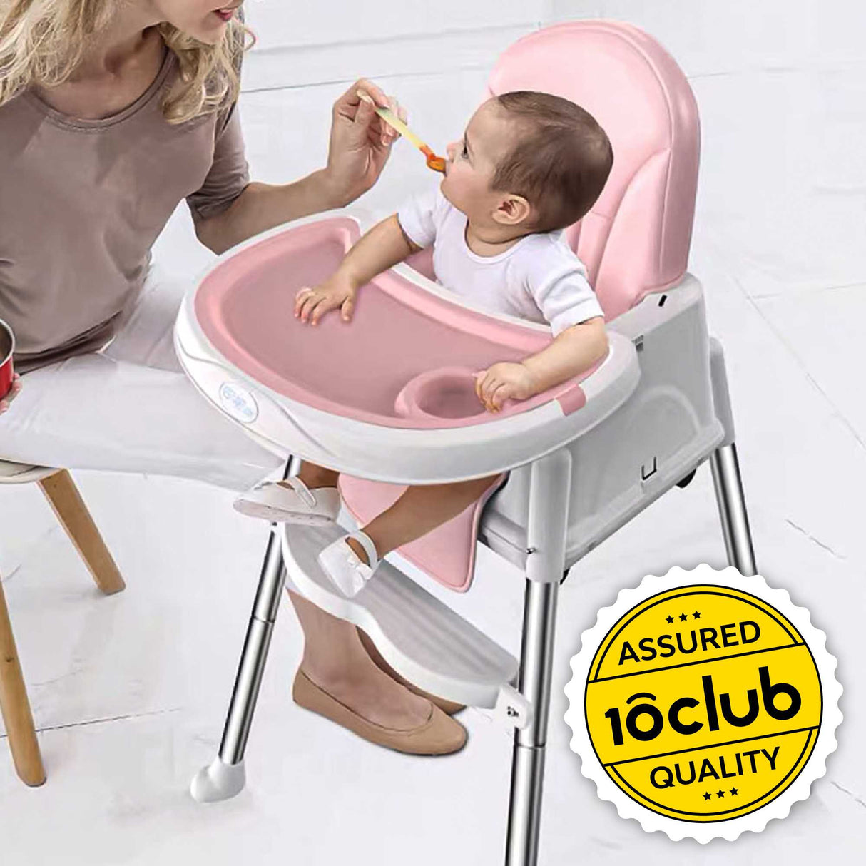 Baby in pink high chair