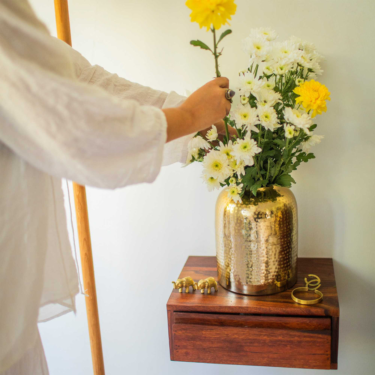 Gold metal vase with flowers